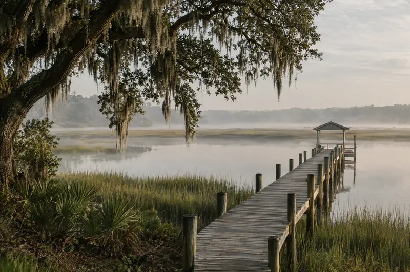Illustrative photo: a wooden dock over the marsh on the May River in Bluffton